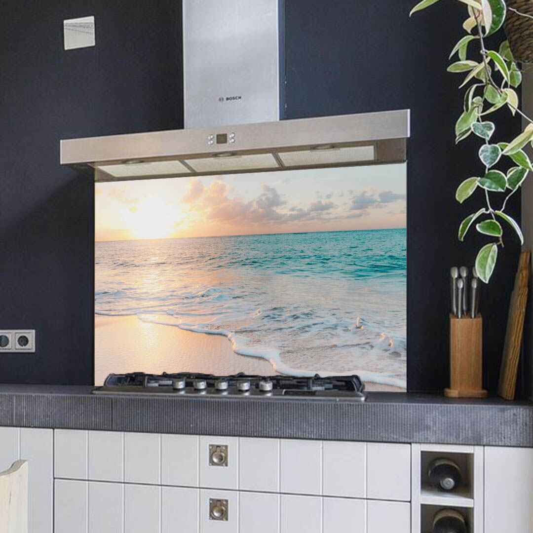 Spatscherm zonsondergang en strand in zachte tinten