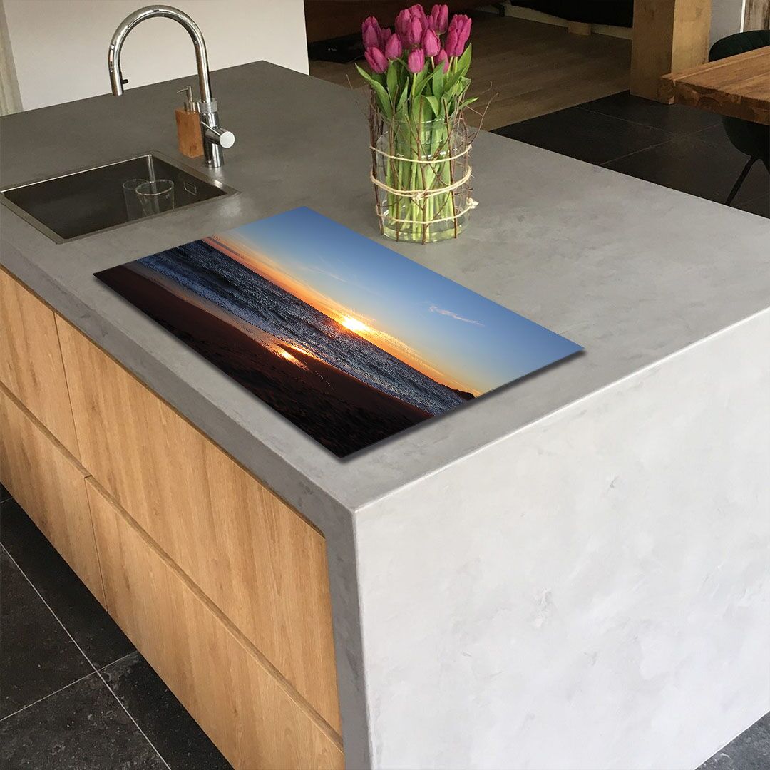 inductie_beschermerm_met_strand_en_ondergaande_zon